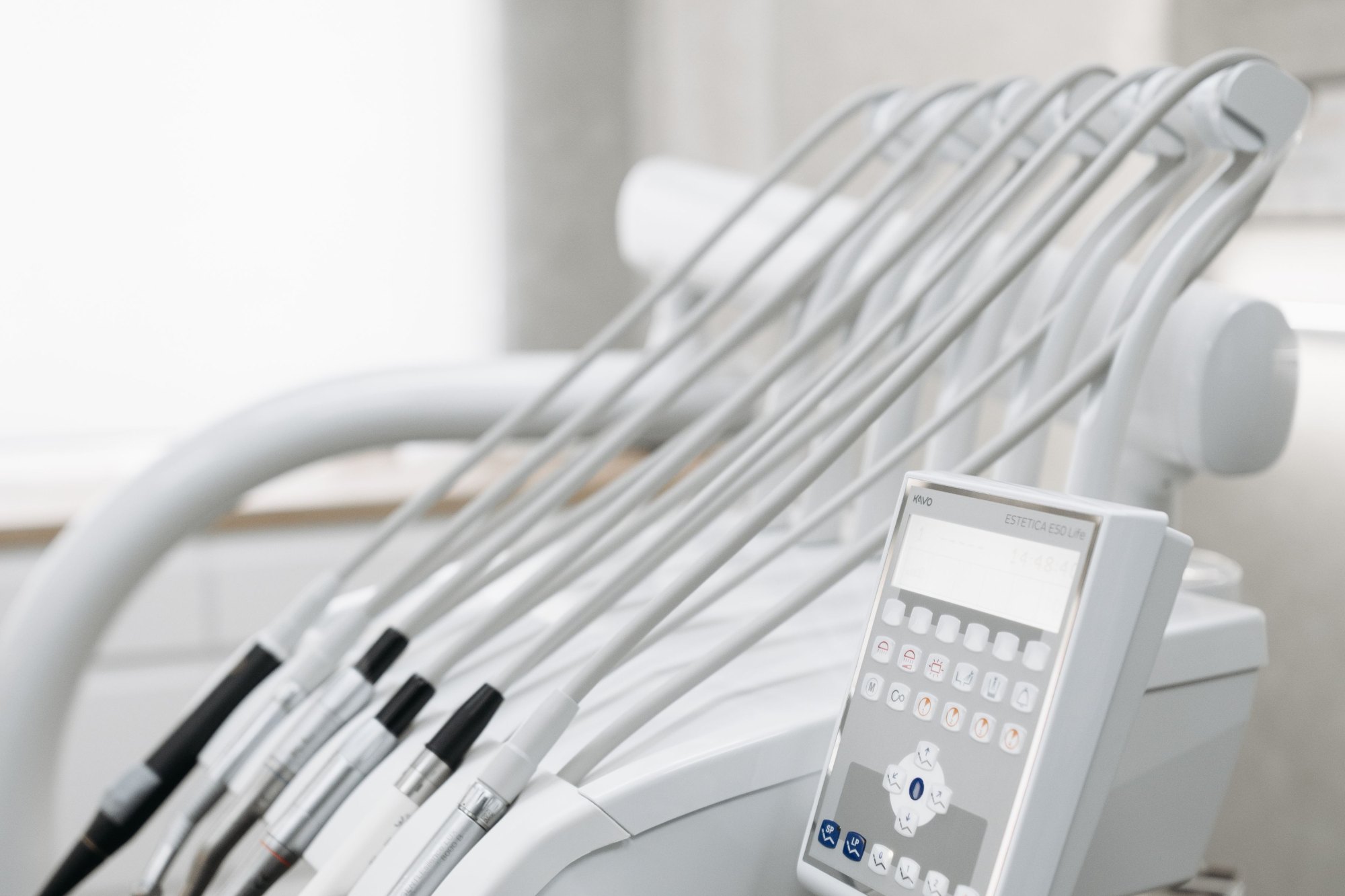 Close-up of modern dental tools in a well-lit dental office, emphasizing advanced healthcare technology.